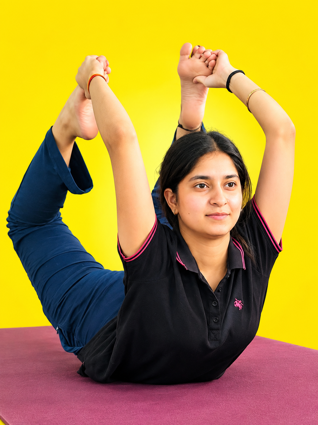Yoga trainer smiling with a student